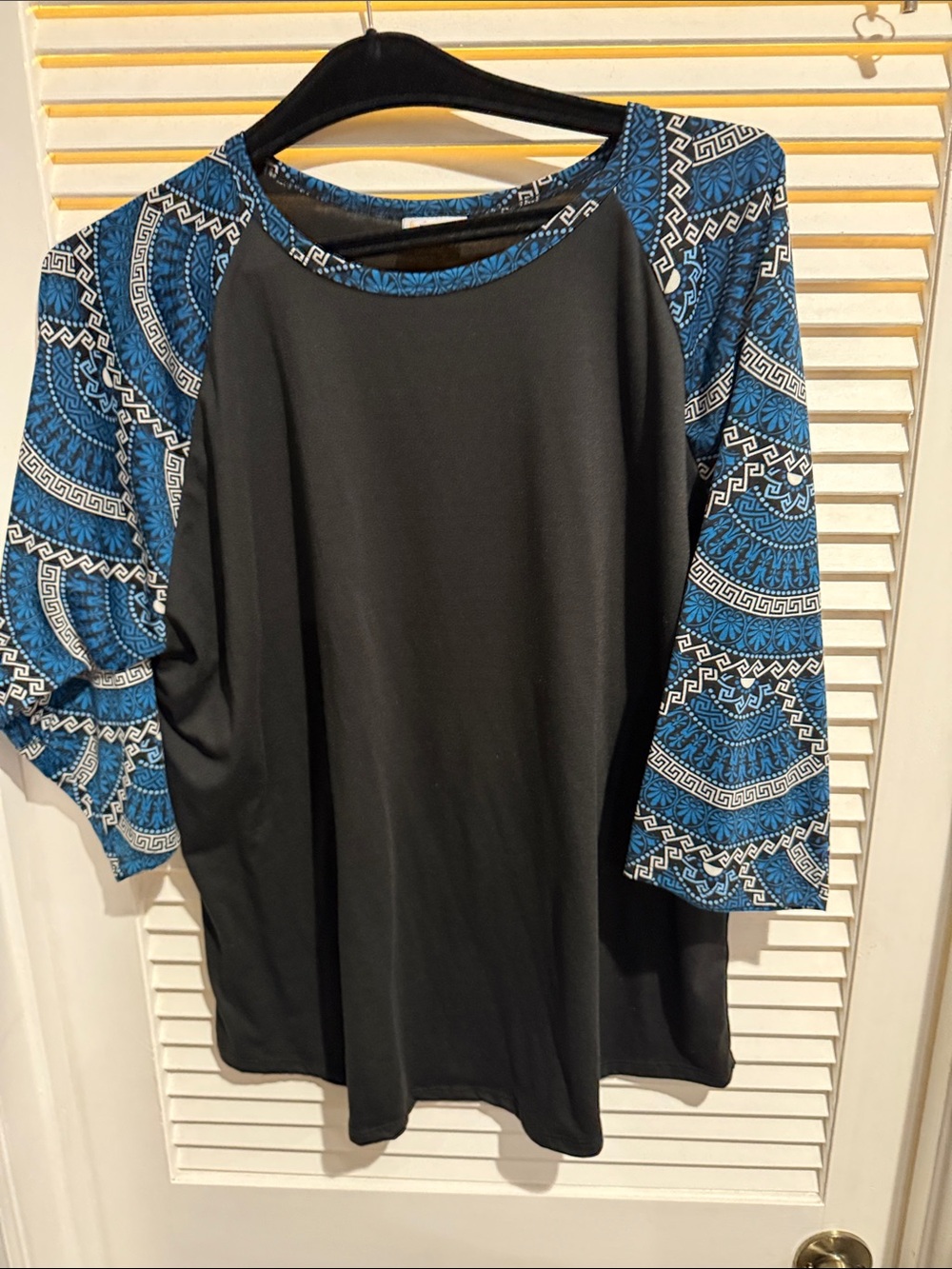 LuLaRoe Black Top with Blue Patterned Raglan Sleeves